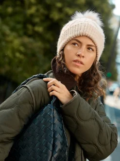 Avoine - Bonnet à pompon en maille pointelle