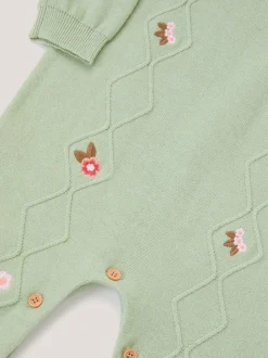 Barboteuse Monsoon nouveau-né brodée en maille torsadée