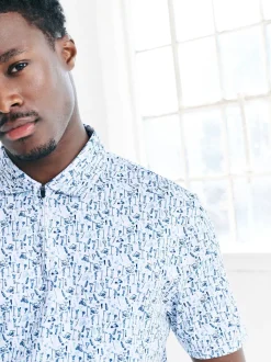 Blanc - Polo de golf à imprimé géométrique actif