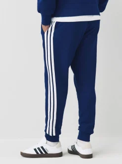 Bleu - adidas Essentiels Pantalon de jogging polaire à rayures 3