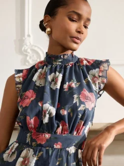 Bleu marine à fleurs - Robe longue imprimée à col haut et à volants