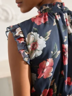 Bleu marine à fleurs - Robe longue imprimée à col haut et à volants