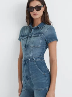 Combinaison en denim Good American évasée en bas