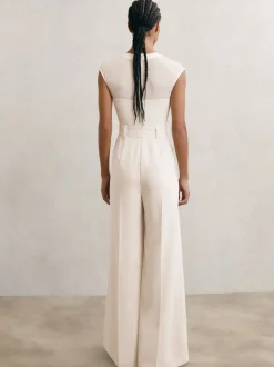 Combinaison-pantalon ceinturée à jambe large et empiècements transparents Reiss Alba