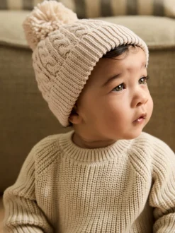 Crème - Bonnet à pompon en maille torsadée