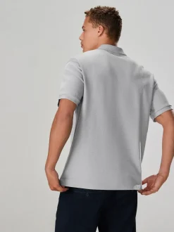 Gris - Polo texturé élégant à col zippé