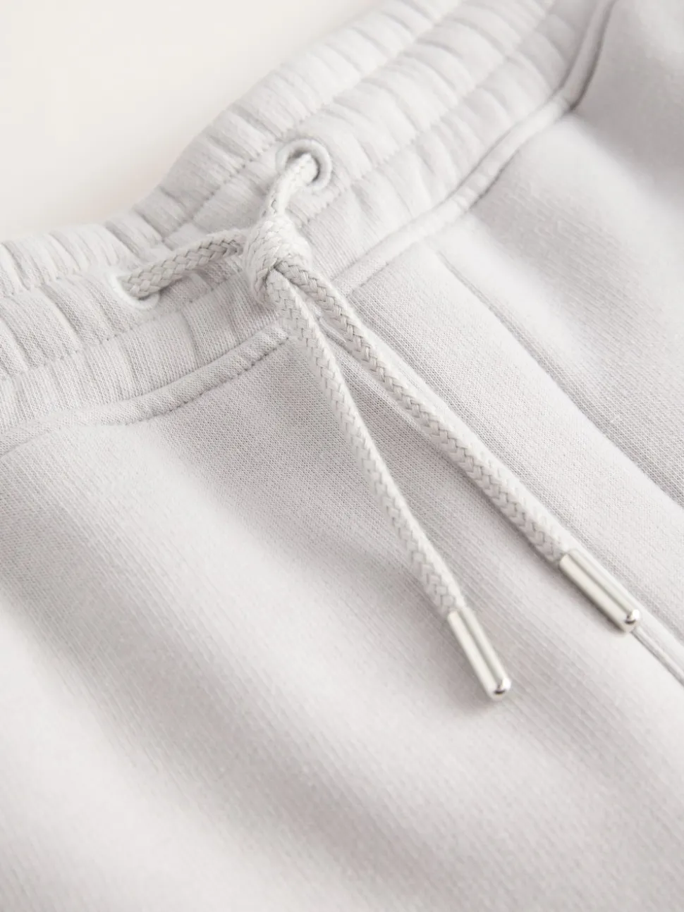 Gris - Short à poche zippée en jersey brossé