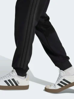 Ground noires - adidas Essentiels Pantalon de jogging polaire à rayures 3