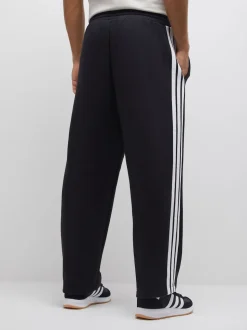 Noir - Pantalons à jambe large en polaires à trois rayures adidas Essentials