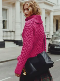 Rose vif - Pull long torsadé à col roulé en laine