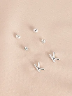 Tonalité argentée - Lot de boucles d’oreilles initiales