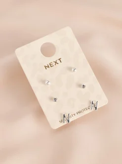 Tonalité argentée - Lot de boucles d’oreilles initiales