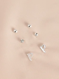 Tonalité argentée - Lot de boucles d’oreilles initiales