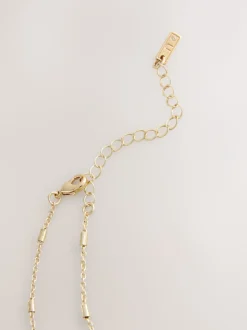 Tonalité d'or - Collier à médaillon cœur