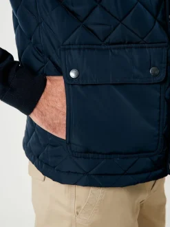 Veste sans manches Saltwell Heritage bleue matelassée à col cheminée en losanges